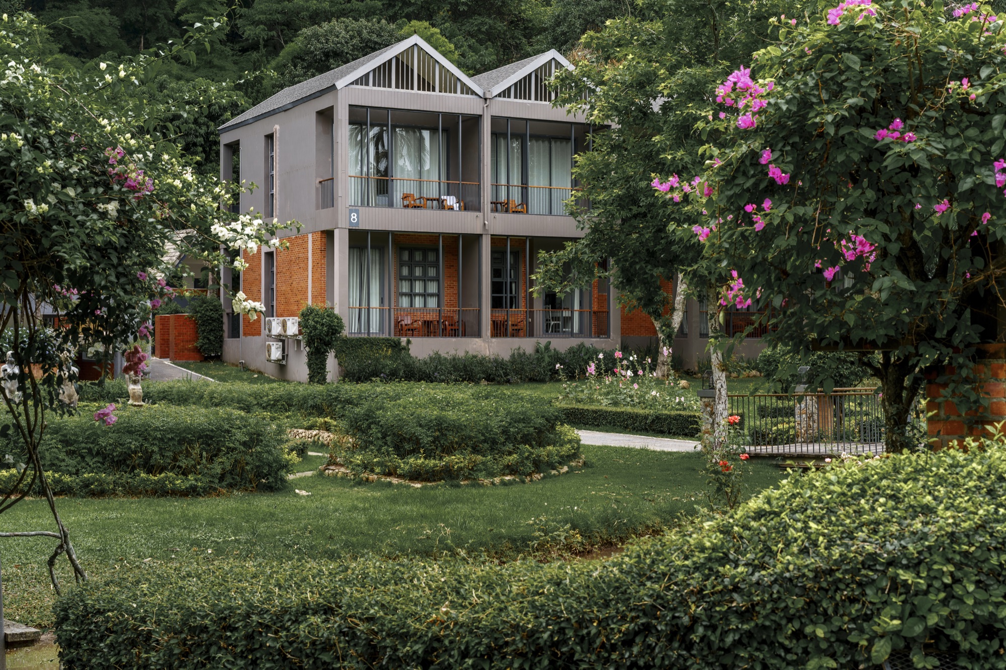 Guest villas set among flowering gardens at Flora Creek Chiang Mai